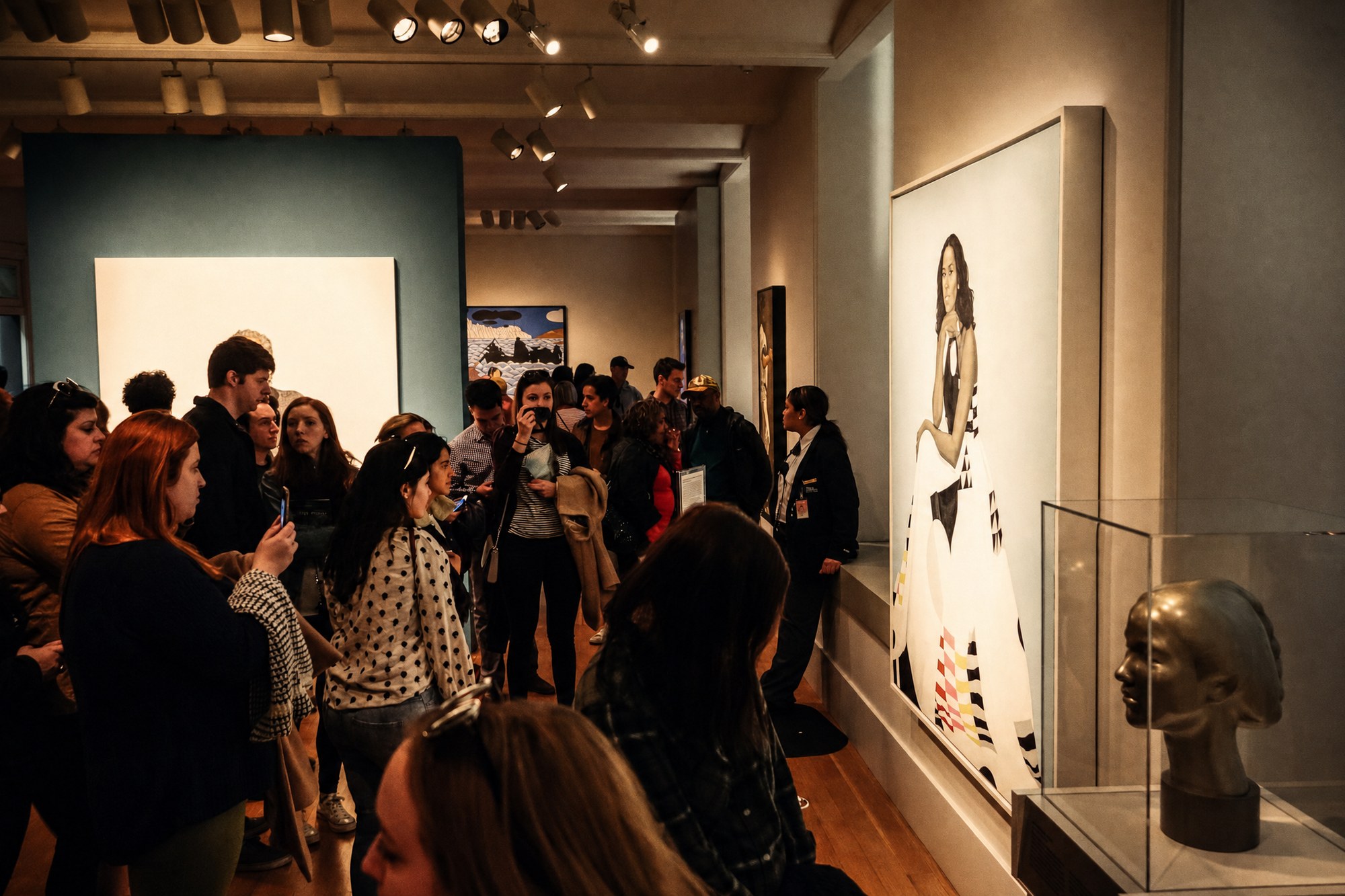 Visitors with the Michelle Obama portrait at the National Portrait Gallery. Photo: Michelle, CC BY 2.0, via Wikimedia Commons. Edited by Culture.